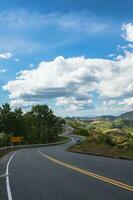 Road No.1081 way from Pua District to Bo Kluea District, Nan THAILAND.The famous view point and that tourists must stop by to check in at nan. Curvy road looks like number 3. photo