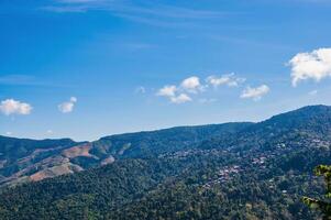 Beautiful mountain view and blue sky at nan province.Nan is a rural province in northern Thailand bordering Laos photo