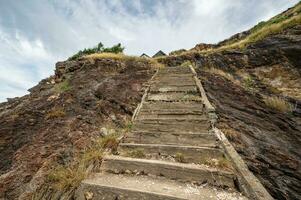 Stone stairway reach to the peak of mountian in the rural of thailand. photo