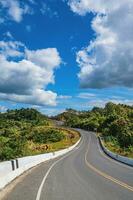 Road No.1081 way from Pua District to Bo Kluea District, Nan THAILAND.The famous view point and that tourists must stop by to check in at nan. Curvy road looks like number 3. photo