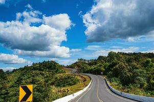 Road No.1081 way from Pua District to Bo Kluea District, Nan THAILAND.The famous view point and that tourists must stop by to check in at nan. Curvy road looks like number 3. photo