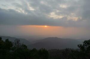 Beautiful sunrise on doi khuntan national park.he Khun Than mountain range of the DoiKhun national park natural boundary between the northern Lamphun Lampang. photo