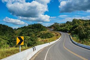 Road No.1081 way from Pua District to Bo Kluea District, Nan THAILAND.The famous view point and that tourists must stop by to check in at nan. Curvy road looks like number 3. photo