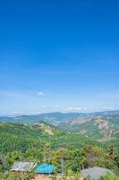 Beautiful mountain view and blue sky at nan province.Nan is a rural province in northern Thailand bordering Laos photo