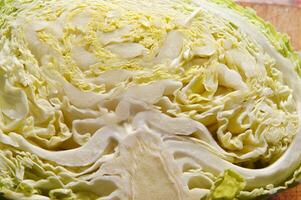 a close up of a cabbage with a knife photo