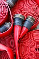 a close up of a red fire hose photo