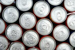 a close up of cans of soda photo