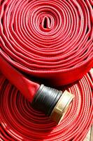 a close up of a red fire hose photo