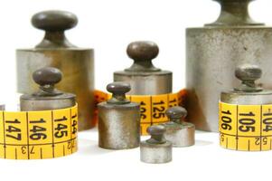 old weights for scales and tape measure to control the diet photo