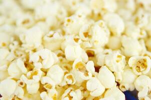 four colorful bowls of popcorn on a white surface photo