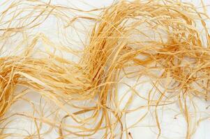 a bunch of brown hair on a white surface photo