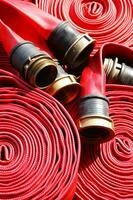 a close up of a red fire hose photo