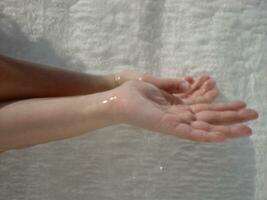 a person's hand is wet photo