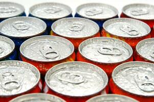 a close up of cans of soda photo