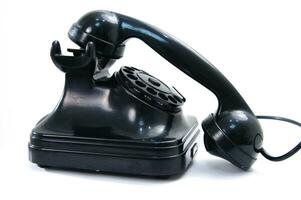 a black telephone on a white background photo