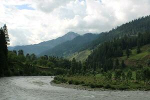 Scenic view of the natural beauty of Tao Butt, Neelum Valley, Kashmir.  Tao Butt is famous for its lush green trees and natural beauty. photo