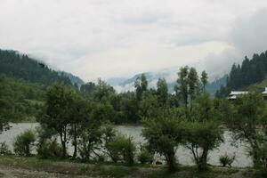 Scenic view of the natural beauty of Tao Butt, Neelum Valley, Kashmir.  Tao Butt is famous for its lush green trees and natural beauty. photo