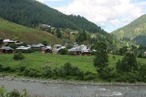 Scenic view of the natural beauty of Tao Butt, Neelum Valley, Kashmir.  Tao Butt is famous for its lush green trees and natural beauty. photo