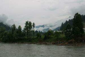 Scenic view of the natural beauty of Tao Butt, Neelum Valley, Kashmir.  Tao Butt is famous for its lush green trees and natural beauty. photo