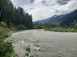 Scenic view of the natural beauty of Tao Butt, Neelum Valley, Kashmir.  Tao Butt is famous for its lush green trees and natural beauty. photo