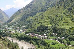 Beautiful day time view of Keran Valley, Neelam Valley, Kashmir. Green valleys, high mountains and trees are visible. photo