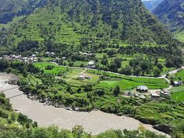 Beautiful day time view of Keran Valley, Neelam Valley, Kashmir. Green valleys, high mountains and trees are visible. photo