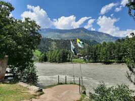 Beautiful day time view of Keran Valley, Neelam Valley, Kashmir. Green valleys, high mountains and trees are visible. photo