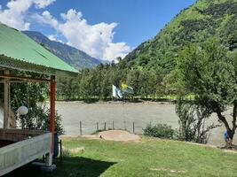 Beautiful day time view of Keran Valley, Neelam Valley, Kashmir. Green valleys, high mountains and trees are visible. photo