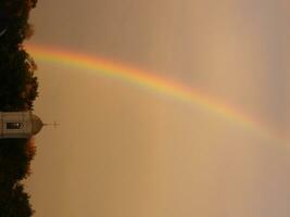 Blue sky and white cloud with sun light and rainbow photo