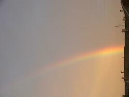 Blue sky and white cloud with sun light and rainbow photo