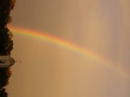 Blue sky and white cloud with sun light and rainbow photo