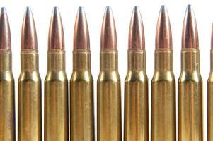 a row of bullet cartridges on a white background photo