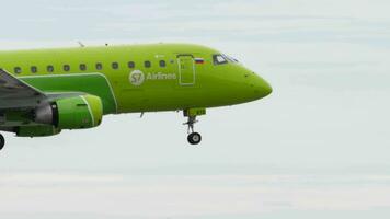 NOVOSIBIRSK, RUSSIAN FEDERATION JULY 15, 2022 - Aircraft Embraer E170, RA02872 of S7 Airlines landing at Tolmachevo airport, side view. Travel concept video