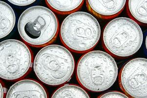 a close up of cans of soda photo