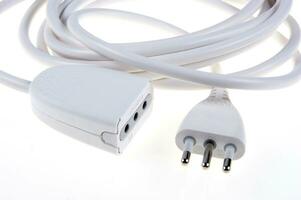 a white cable with two plugs on a white surface photo