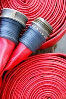 a close up of a red fire hose photo