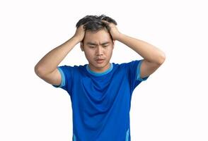 Young man touching his head and keeping eyes closed isolated on white background,  suffering from severe headache or migraine pain while working, crisis, problem, and mistake, Feeling stressed photo