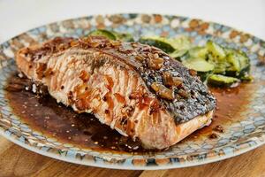 Salmon chunks glazed with beer and maple syrup photo