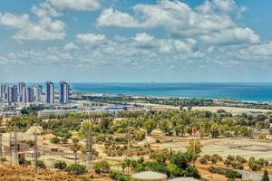 View of the Naot Peres district of Haifa, the stadium and the sea coast photo