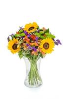 Beautiful huge bouquet of sunflowers with lilies in vase on white background photo