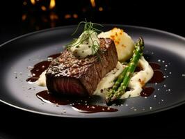 Steak with asparagus and mashed potatoes on plate in restaurant photo