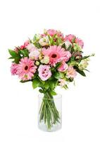Beautiful huge bouquet of pink gerberas and lisianthus in vase on white background photo