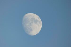 Moon seen during the day in crescent photo