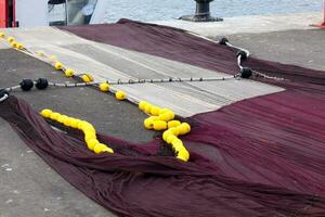 Fishing nets stretched out in the harbour photo