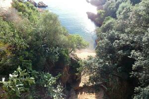 Costa brava and coastal path along the rugged coastline of northern catalonia, Spain photo