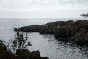 Costa brava and coastal path along the rugged coastline of northern catalonia, Spain photo