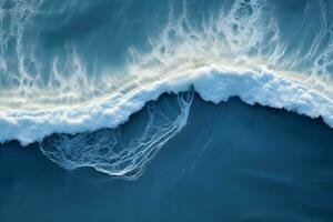 an aerial view of a wave breaking on the ocean.Drone photo backdrop of sea wave in bird eye waves. generative ai