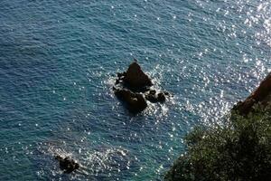 Rocks and sea in the catalan costa brava, mediterranean sea, blue sea photo