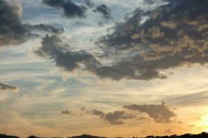 Scattered clouds in the sky indicating a change in weather. photo