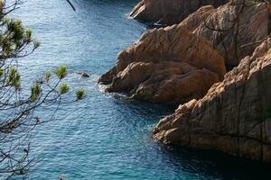 Rocks and sea in the catalan costa brava, mediterranean sea, blue sea photo